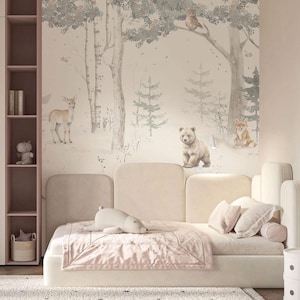 May include: A child's bedroom with a forest-themed mural featuring deer, a bear, and a fox. The room includes a bed with a pink blanket and pillows, a plush toy, and a bookshelf. The color scheme is soft and neutral.