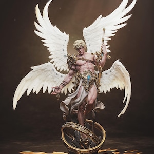 May include: A detailed statue of an angel with large white wings, holding a staff. The angel is adorned with gold armor and a white cloth. The statue stands on a base with a golden ring, set against a dark background.