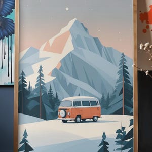 May include: A framed print featuring a stylized illustration of a vintage orange and white van in a snowy landscape with a mountain backdrop. The artwork has a minimalist aesthetic with a palette of orange, blue, and white.