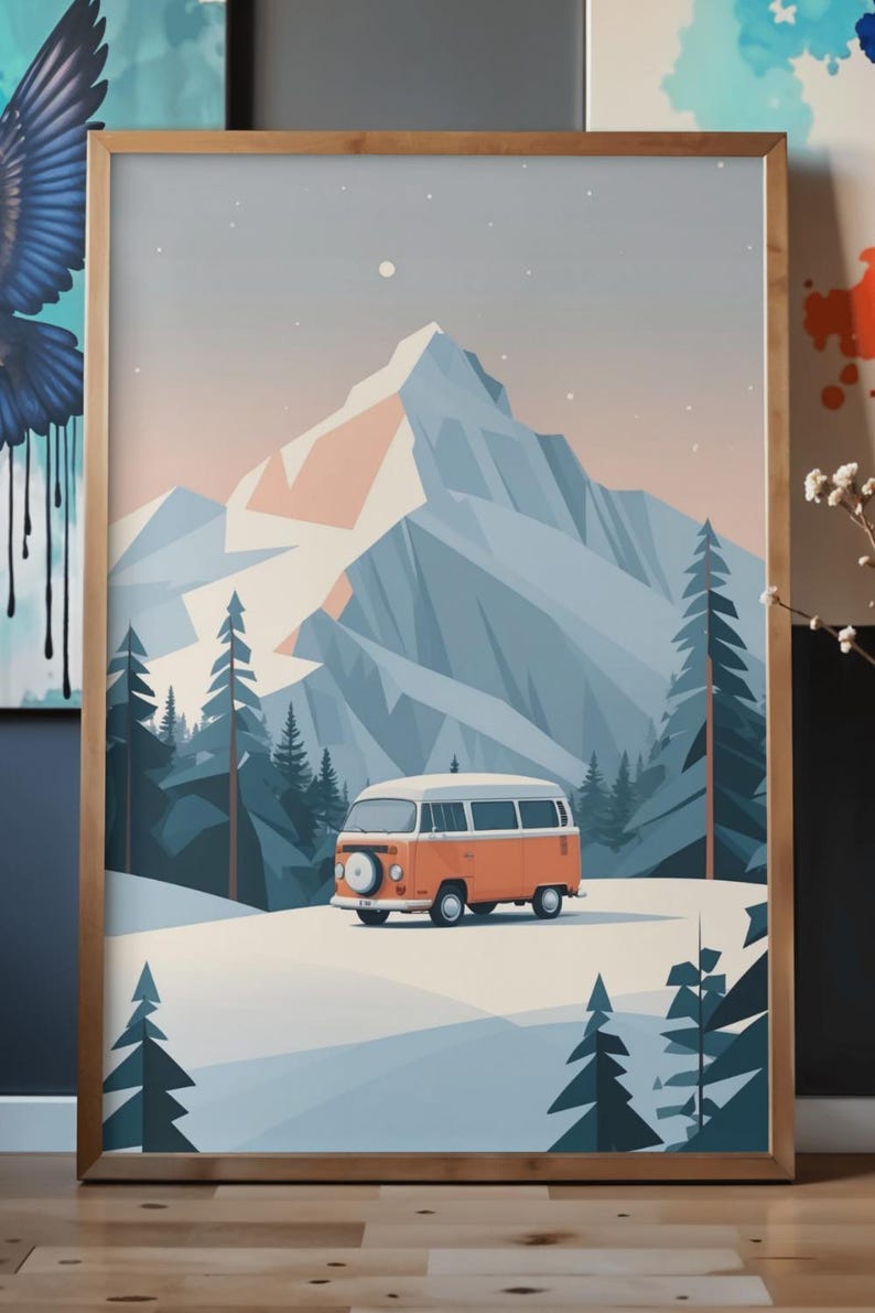 May include: A framed print featuring a stylized illustration of a vintage orange and white van in a snowy landscape with a mountain backdrop. The artwork has a minimalist aesthetic with a palette of orange, blue, and white.