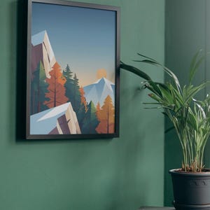 May include: A framed art print depicting a mountain landscape with a sunset. The artwork features geometric shapes and a color palette of blue, orange, and green. The frame is black, and the print is hanging on a green wall.