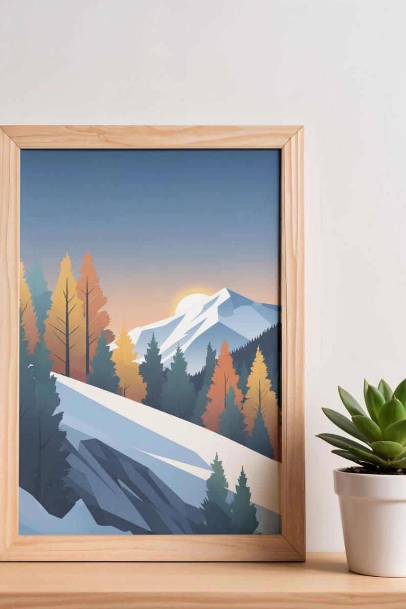 May include: A framed art print featuring a stylized mountain landscape. The artwork depicts snow-covered mountains, evergreen and autumn-colored trees, and a setting sun. The frame is made of light-colored wood.