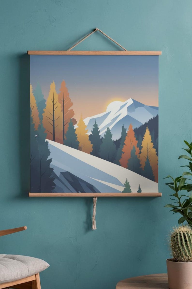May include: A landscape art print featuring a mountain scene with a sunset. The artwork showcases a snow-covered mountain, evergreen and autumn-colored trees, and a setting sun. The print is displayed with wooden bars and a hanging cord.