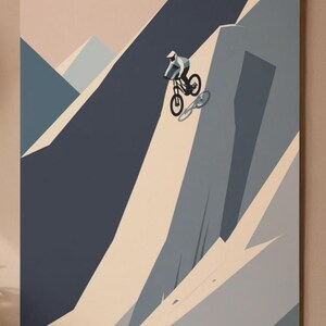 May include: A mountain biking art print depicts a cyclist descending a steep mountain slope. The artwork uses a minimalist style with shades of blue, gray, and beige. The cyclist is wearing a white helmet and blue clothing.