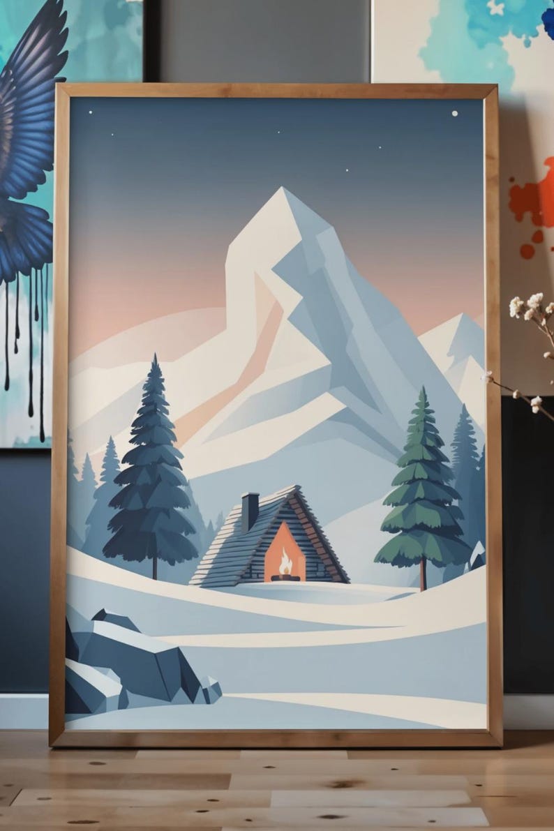 May include: A framed print depicting a winter scene with a snow-covered cabin and a lit fireplace, set against snow-covered mountains and evergreen trees. The artwork has a minimalist style with a colour palette of blues, whites, and warm orange.