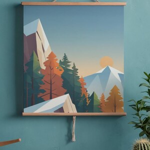 May include: A landscape art print featuring a mountain scene with trees and a setting sun. The artwork is displayed on a wooden frame with a hanging string. The color palette includes shades of blue, green, orange, and white.