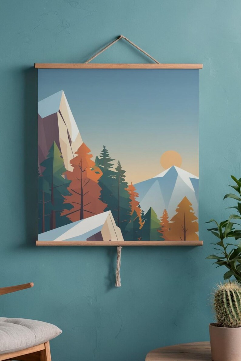 May include: A landscape art print featuring a mountain scene with trees and a setting sun. The artwork is displayed on a wooden frame with a hanging string. The color palette includes shades of blue, green, orange, and white.