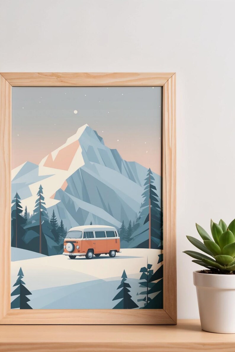 May include: A framed print featuring a stylized mountain landscape with a vintage orange and white camper van. The artwork depicts a snowy scene with pine trees and a large mountain range under a light blue sky. The frame is made of light-colored wood.