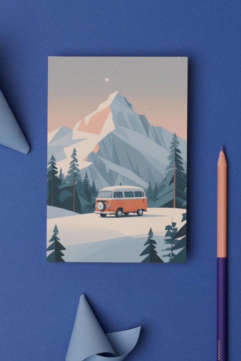May include: An illustration of an orange and white camper van driving through a snowy landscape with a mountain backdrop. The artwork features a minimalist style with a color palette of orange, white, blue, and gray. The image is on a blue surface with a pencil and paper decorations.