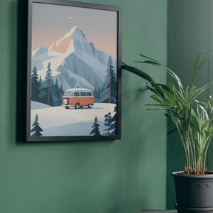 May include: Framed art print featuring a stylized illustration of a mountain landscape with an orange and white camper van. The artwork has a minimalist design with a color palette of blues, oranges, and whites. The print is in a black frame.