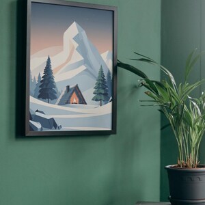 May include: Framed art print showing a mountain landscape with a cabin and evergreen trees. The artwork features a snow-covered scene with a mountain range in the background. The cabin has a warm glow from the fire. The frame is black.