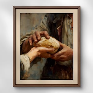 May include: A framed painting depicts two sets of hands sharing a loaf of bread. The hands are the focal point, with the bread positioned between them. The artwork uses a muted color palette, with warm tones dominating the scene. The painting is in a brown wooden frame.