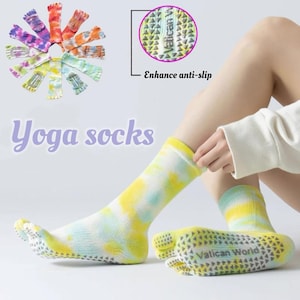 May include: Tie-dye yoga socks in yellow, blue, and white. The socks have a non-slip grip on the soles and the text "Vatican World". The image also shows a close-up of the anti-slip feature and the text "Enhance anti-slip".