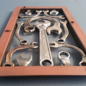 Hand formed old wrench metal panel.   One of a kind made in my studio / shop.