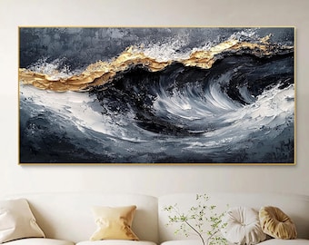 May include: Abstract painting of a large wave with gold accents on a dark blue and white background. The painting is framed in a thin gold frame.