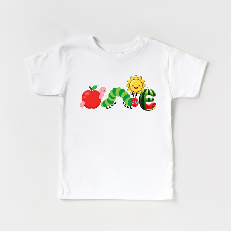 a white t - shirt with a picture of the very hungry caterpillar