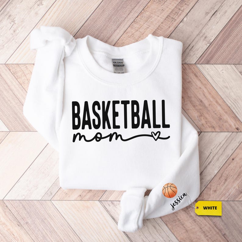 a white sweatshirt with the words basketball mom on it
