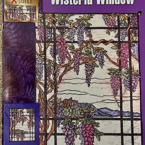 May include: A cross-stitch pattern leaflet titled "Wisteria Window" featuring a colorful design of wisteria flowers and a window frame. The finished size is 16.75" x 13" (42.5 cm x 33 cm).