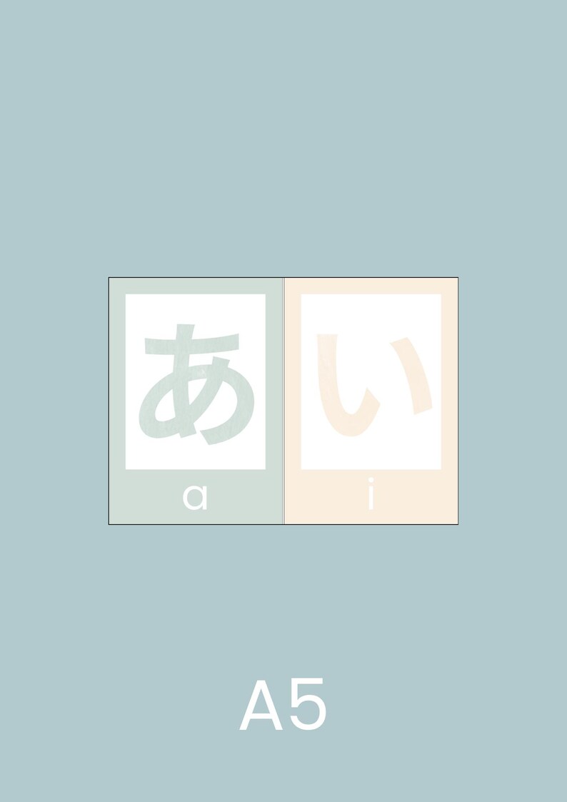 May include: Two white squares with Japanese characters, "あ" and "い", in green and pink, respectively. The squares are labeled "a" and "i" in white. The background is light blue. The text "A5" is printed in white below the squares.