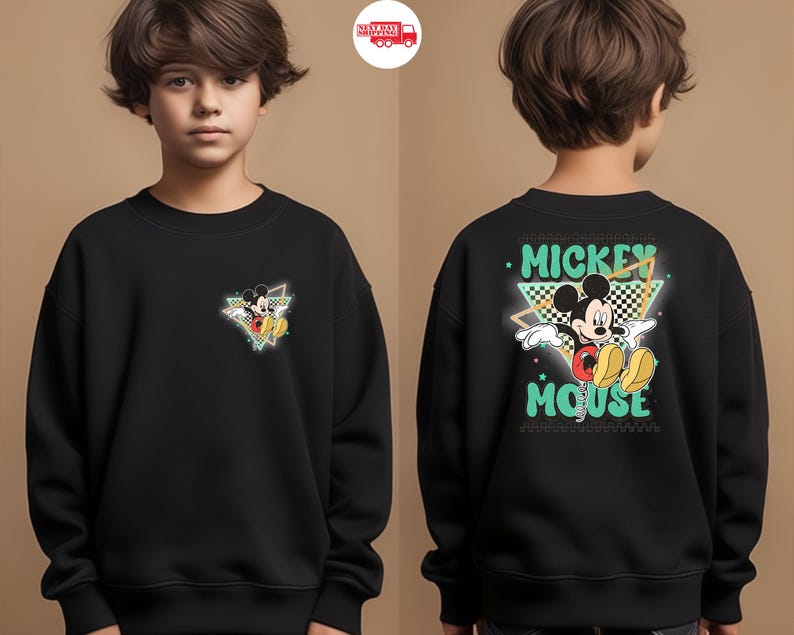 May include: Black sweatshirt featuring Mickey Mouse. The front has a small graphic of Mickey in a triangle. The back displays "Mickey Mouse" in a retro font with Mickey Mouse in the center. The design includes green, yellow, red, and black.