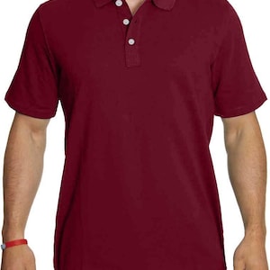 May include: A solid maroon short-sleeved polo shirt with a button-up collar.
