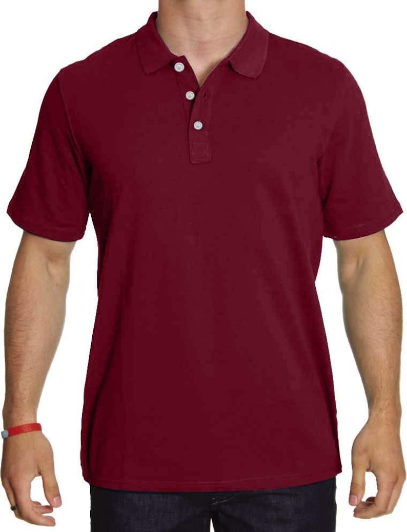 May include: A solid maroon short-sleeved polo shirt with a button-up collar.