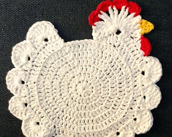 May include: White crocheted chicken dishcloth with a red and yellow comb.