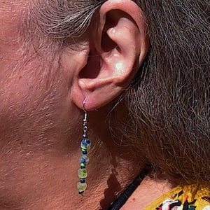 Blue and green glass dangle earrings with silver hook.