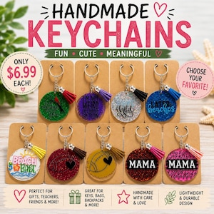 May include: A collection of nine circular acrylic keychains, each featuring a metal ring and a colorful tassel. The designs include various text and graphics such as 'BEACH BABE', 'MAMA', footballs, and glittery finishes, all displayed on individual brown cards.