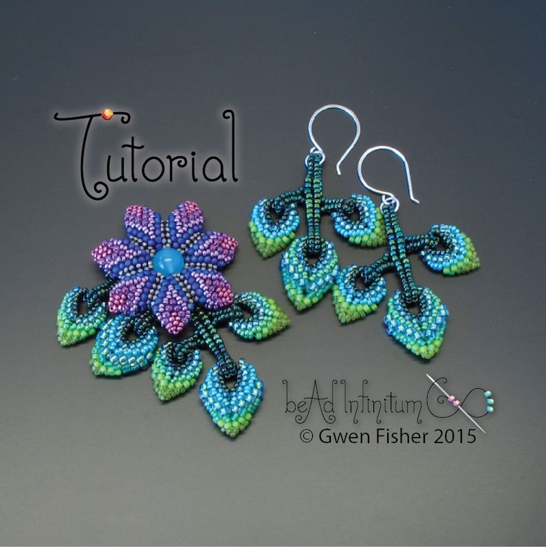 May include: A pair of beaded earrings with a flower design. The earrings are made with blue, green, and purple beads. The earrings are hanging from silver hooks. The earrings are labeled "bead infinitum" and "Gwen Fisher 2015".