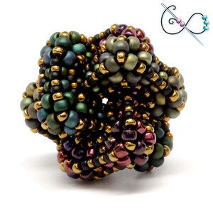 May include: A handcrafted beaded ring featuring a complex, three-dimensional design. The ring showcases a mix of dark green, purple, and gold beads, creating a textured, eye-catching piece. The design includes a diagram of the beading process.