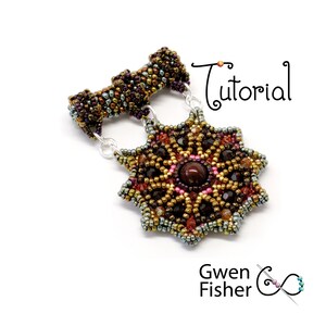 May include: A beaded pendant with a starburst design in shades of brown, gold, and red. The pendant features a red gemstone in the center and is attached to a silver chain.