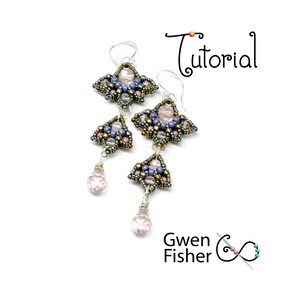 May include: A pair of silver earrings with a pink, purple, and gold beaded design. The earrings feature a teardrop-shaped crystal pendant.