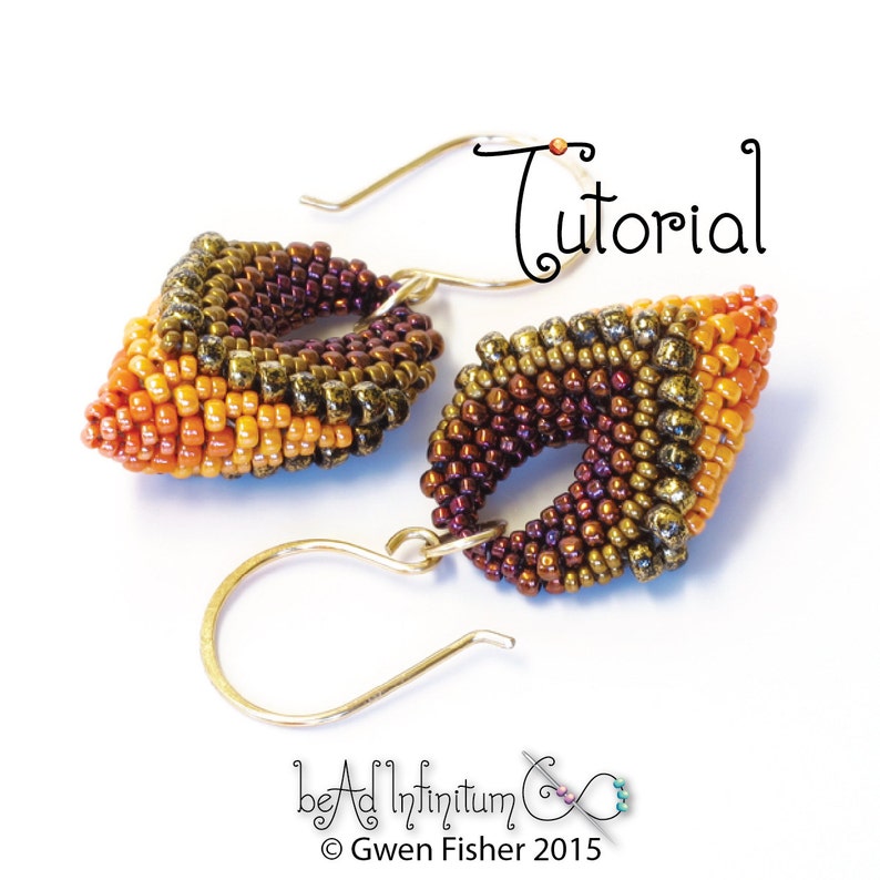 May include: A pair of earrings with a geometric design made with orange, brown, and gold beads. The earrings are attached to gold hooks.