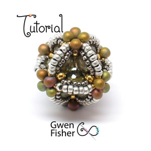 May include: A beaded sphere with a geometric design, featuring silver, gold, and green beads. The sphere is approximately 1 inch in diameter.