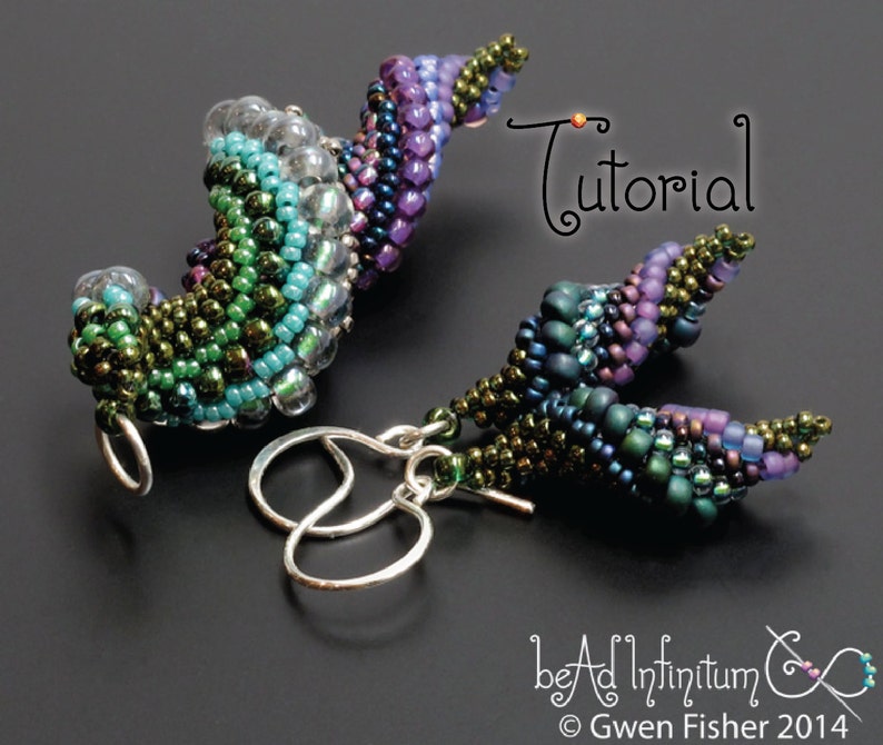 May include: A pair of beaded earrings with a spiral design in shades of green, purple, and blue. The earrings are made with small seed beads and have silver ear wires. The image includes the text "Tutorial".