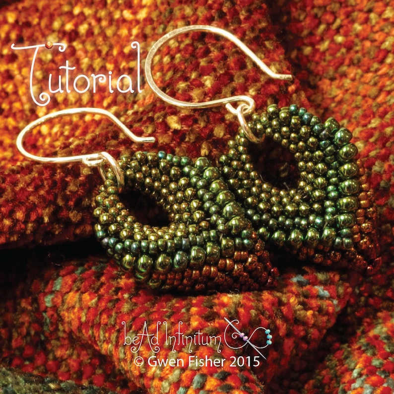 May include: A pair of green and brown beaded earrings with silver hooks. The earrings are shaped like a teardrop and have a gradient of color from dark green to brown. The earrings are on a red and orange fabric background. The text "Tutorial" is in the top left corner of the image. The text "Bead Ad Infinitum" and "Gwen Fisher 2015" are in the bottom center of the image.