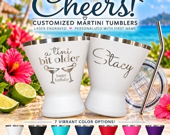 May include: Two white stainless steel martini tumblers with laser-engraved text. One tumbler features the text 'a tini bit older' with martini glasses and 'happy birthday', while the other is personalized with the name 'Stacy'.