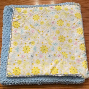 May include: A set of three ceramic nesting bowls in shades of blue, green, and white. The bowls feature a speckled glaze and a simple, modern design. The largest bowl measures approximately 6 inches in diameter.