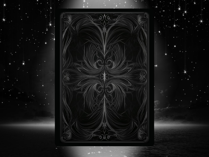 May include: A black and white illustration of a playing card. The card features an ornate, symmetrical design in shades of gray, set against a dark background with a starry night sky. The design has a floral and swirling pattern.