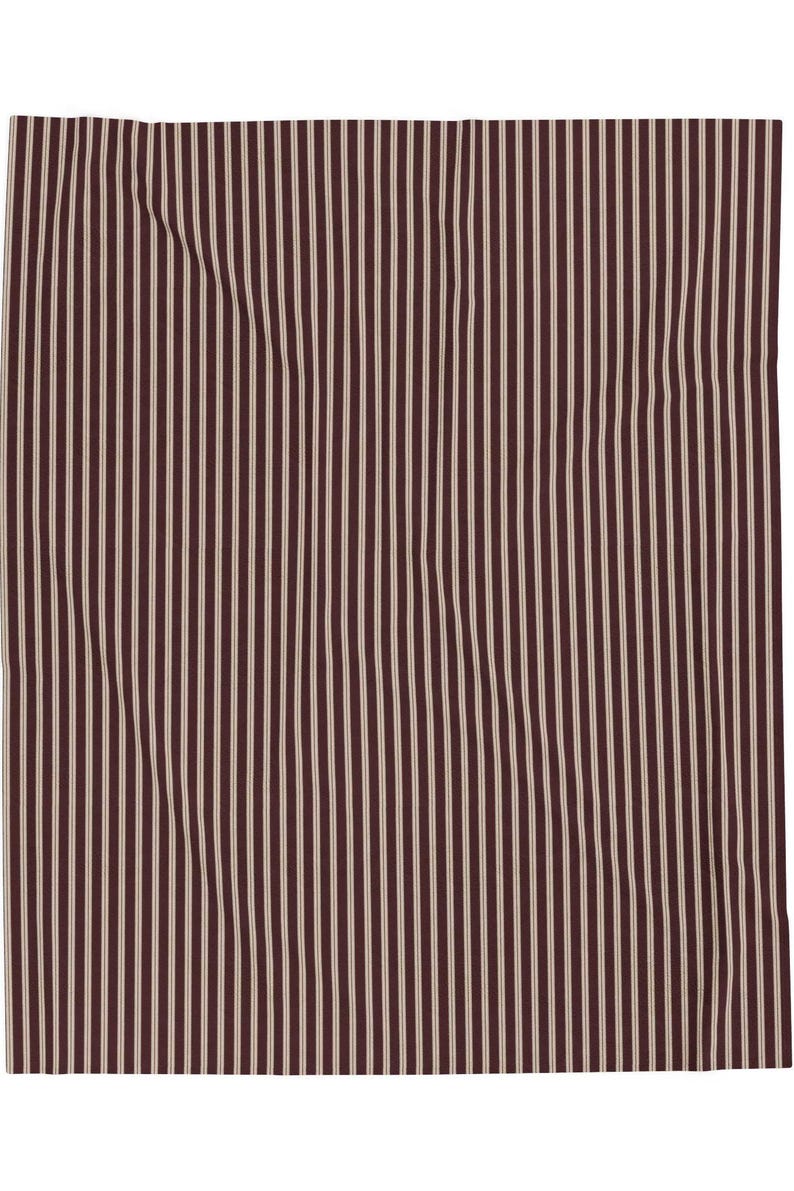 Burgundy striped velveteen plush blanket flat lay