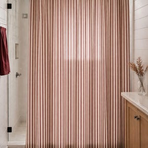 Classic pinstripe shower curtain with burgundy and neutral cream stripes, modern bathroom style