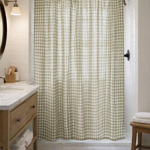 Cottagecore bathroom with green and white checkered shower curtain