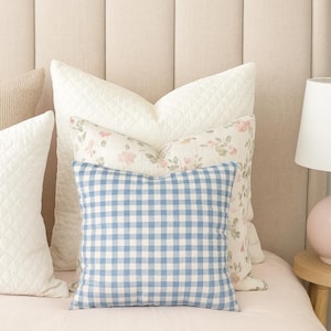 blue white checkered throw pillow on a classic style bedroom