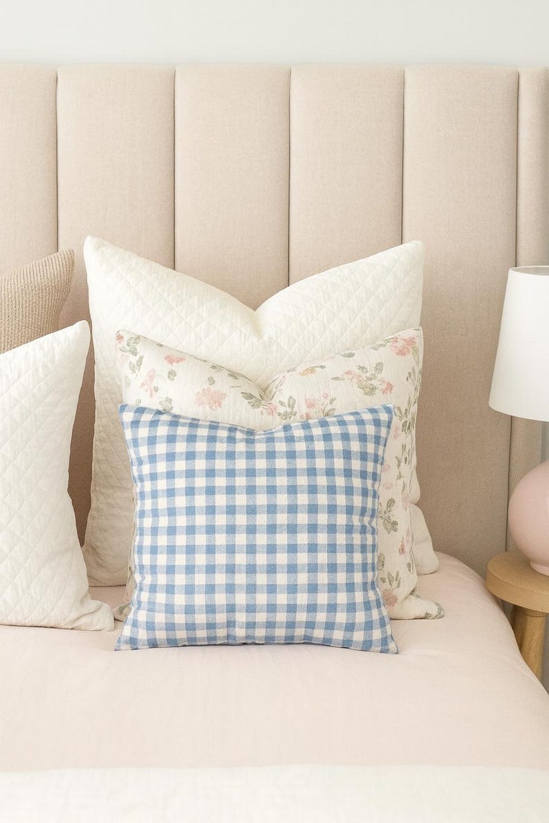 blue white checkered throw pillow on a classic style bedroom