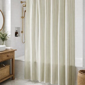 Cottagecore bathroom with natural sage green shower curtain