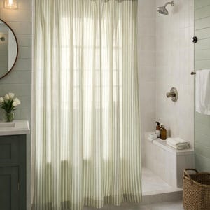 Modern farmhouse bathroom featuring sage and cream vertical striped curtain