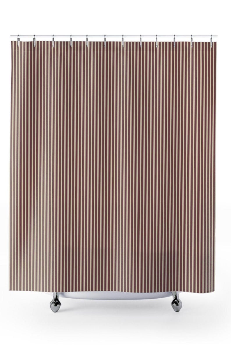Warm minimalist bathroom with burgundy stripe curtain