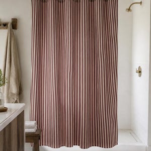 Classic pinstripe shower curtain with burgundy and neutral cream stripes, modern bathroom style