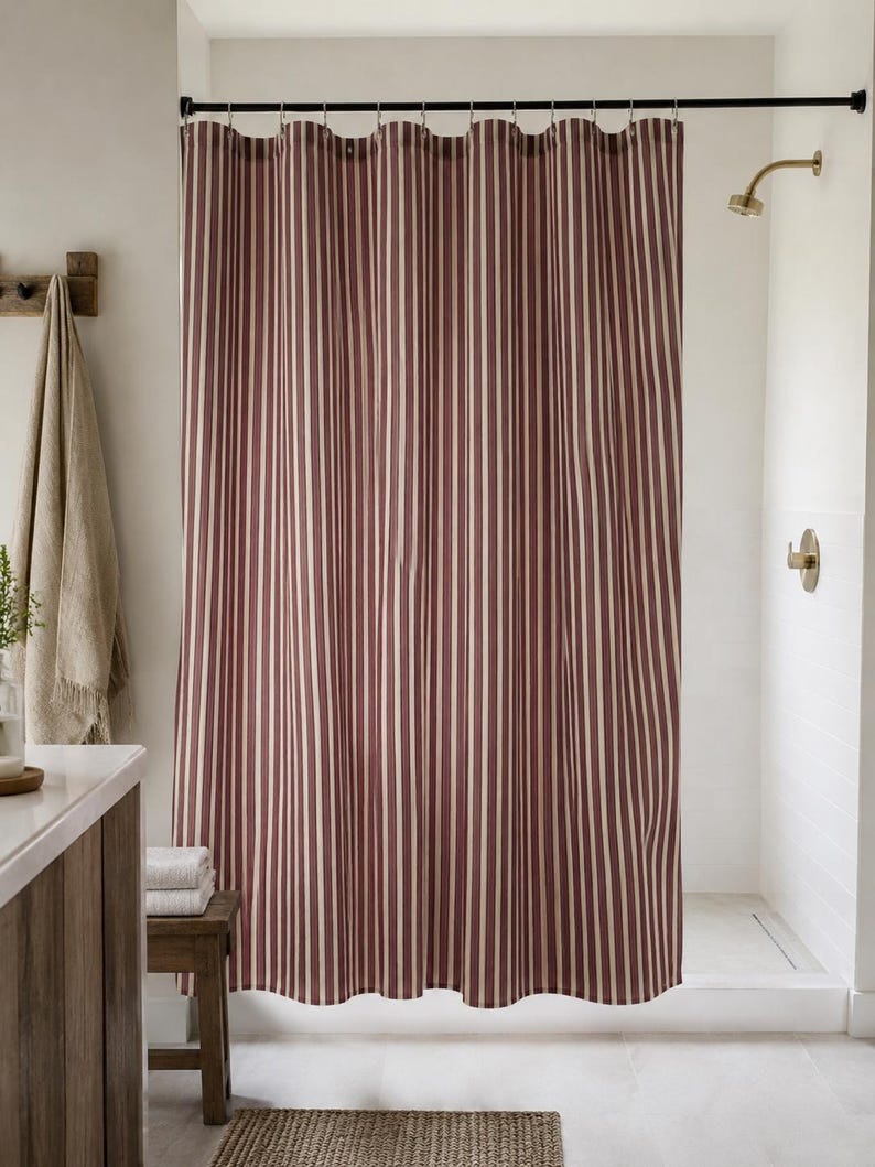 Classic pinstripe shower curtain with burgundy and neutral cream stripes, modern bathroom style